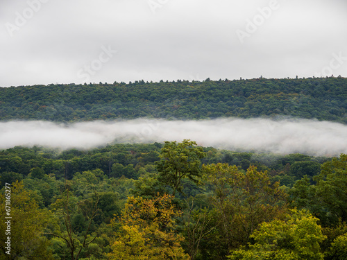 Woody mountains with a band of clouds across near Mathias and Lost City in West Virginia, USA.