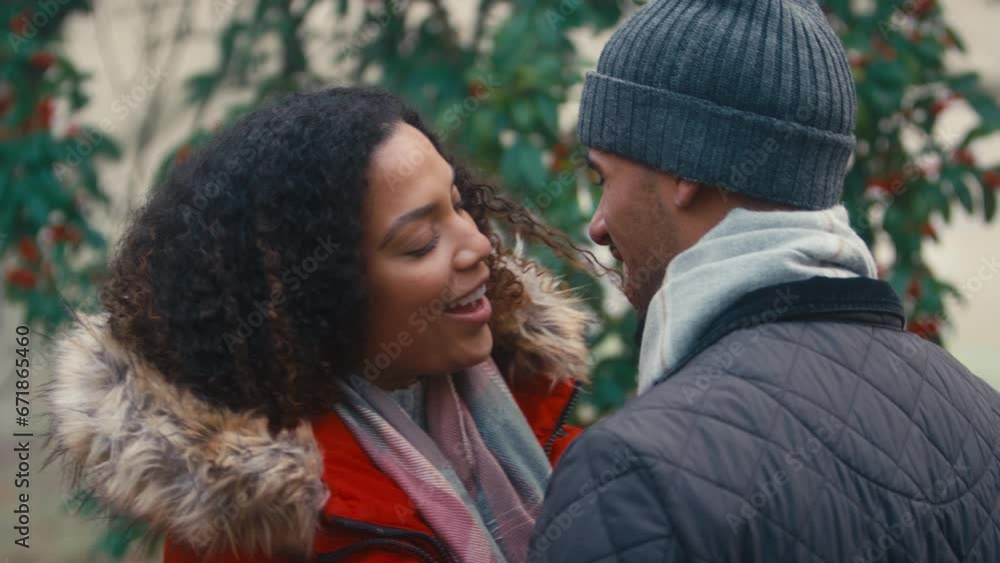 Couple wearing coats and scarves meeting for cold walk in misty autumn or winter countryside - shot in slow motion Couple wearing coats and scarves meeting for cold walk in misty autumn or winter countryside - shot in slow motion