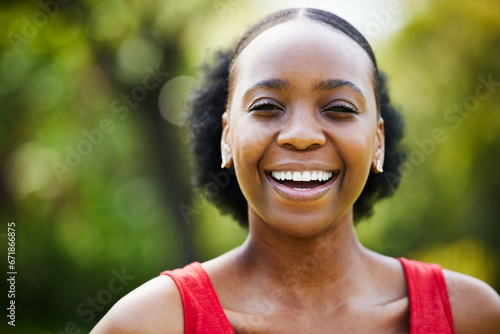 Portrait, smile and black woman in park, outdoor and garden with natural confidence, good mood and freedom in Nigeria. Face, happy african female person and laughing in summer or relax in nature