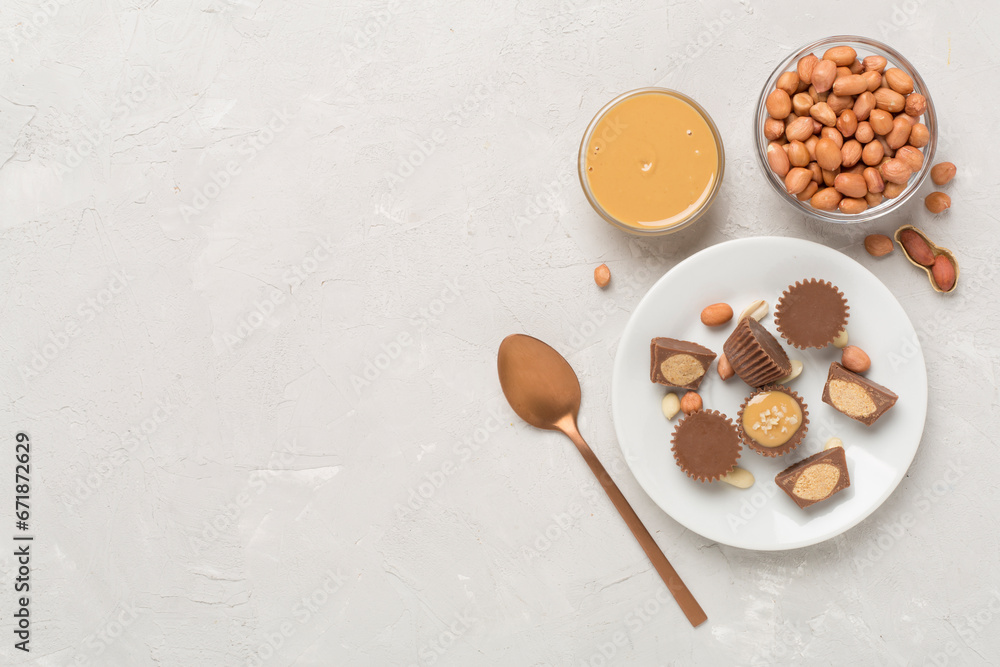 Delicious peanut butter cups with nuts on concrete background, top view Delicious peanut butter cups with nuts on concrete background, top view