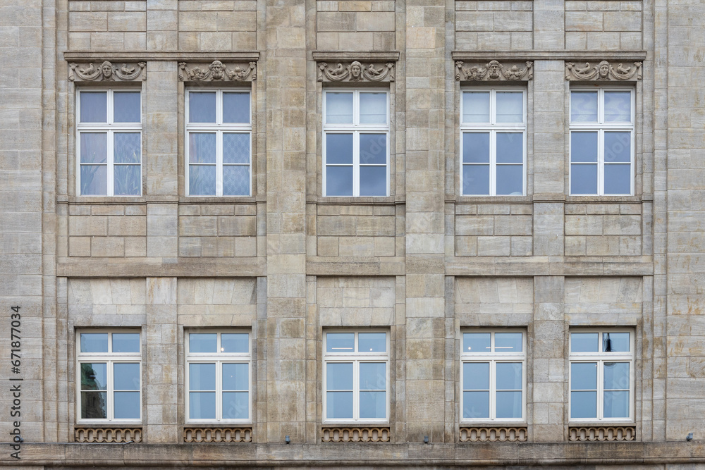 Windows of an old building in Paris, France. Architectural background Windows of an old building in Paris, France. Architectural background