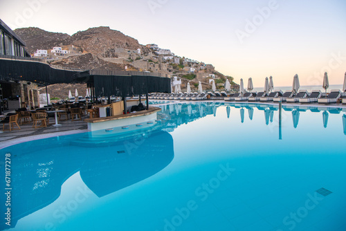Blue Pool near the building on a background of blue sky and sea in Greece. © Kyrenian