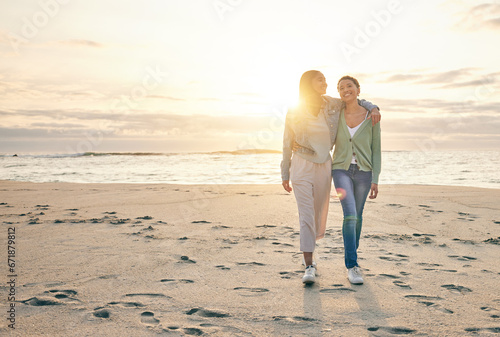 Love, beach and sunset, lesbian couple walking together on sand, sunset holiday adventure or hug on date. Lgbt women, bonding and relax on ocean vacation with romance, pride and happy nature travel.