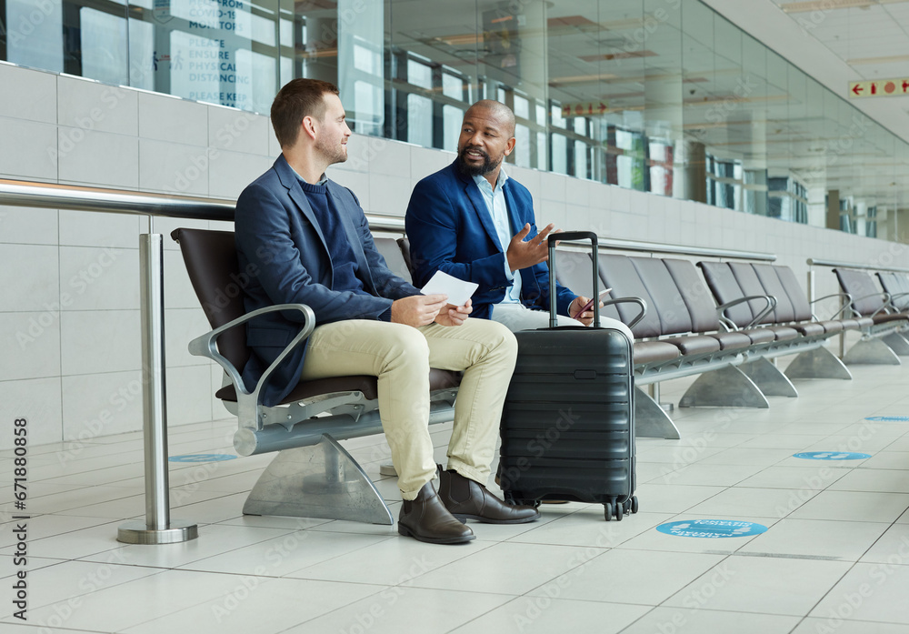 Ticket, airport and business partner or people talking of flight schedule, travel news or schedule update together. Conversation, waiting room and international or professional person with suitcase Ticket, airport and business partner or people talking of flight schedule, travel news or schedule update together. Conversation, waiting room and international or professional person with suitcase
