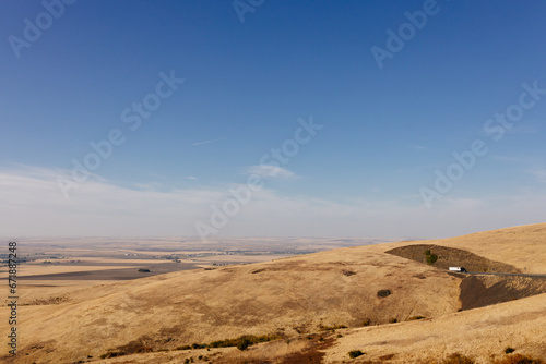 Beautiful autumn landscape with meadows and a road from a bird s eye view. Nature in Oregon in fall. Panorama. Pendleton  Oregon  USA