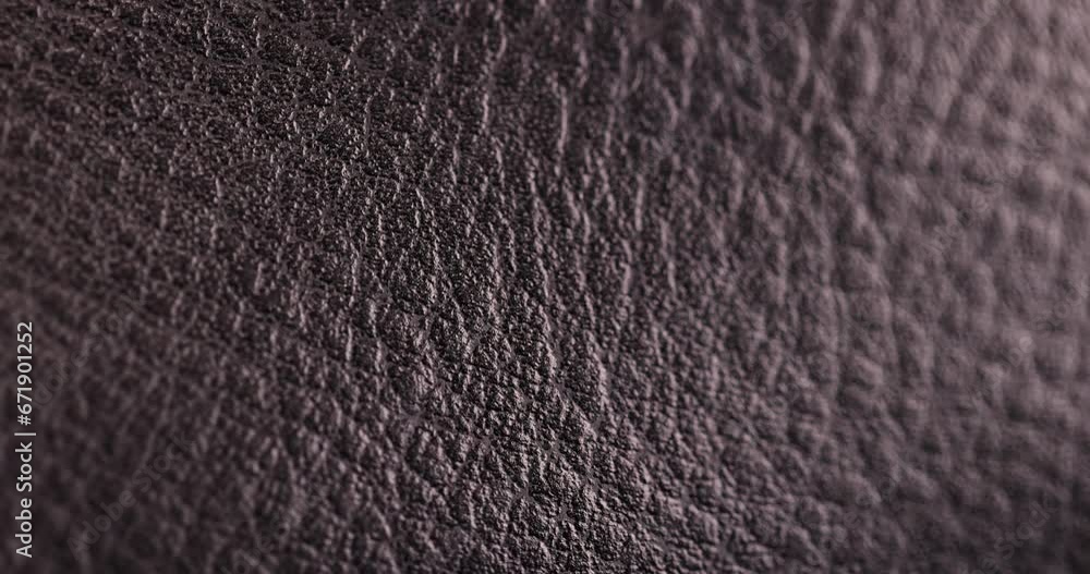 focus on background of black leather close-up, painted in black leather for the manufacture of goods focus on background of black leather close-up, painted in black leather for the manufacture of goods