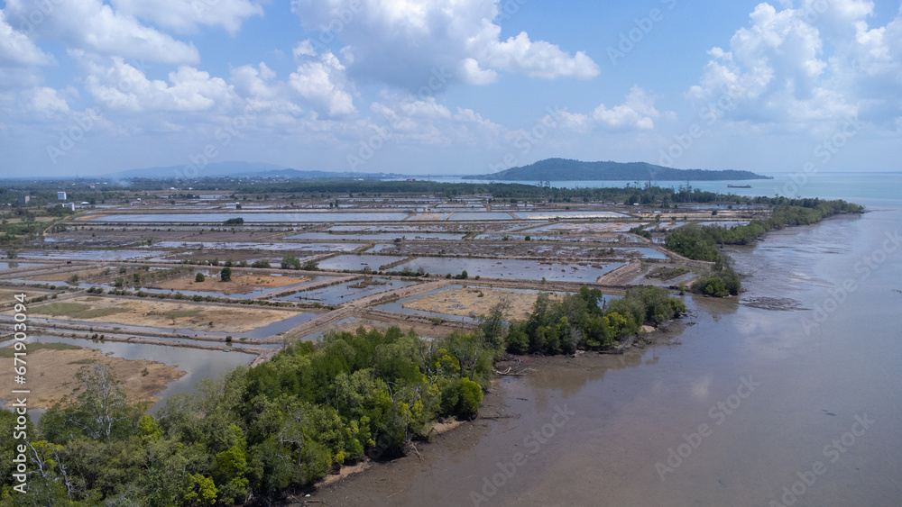 Aerial view of the fish farming area with very large land located on the edge of the sea Aerial view of the fish farming area with very large land located on the edge of the sea