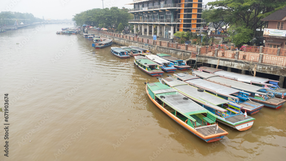 Banjarmasin's Siring river area which is filled with rental engine boats used for Banjarmasin river tourism