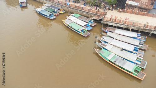 Banjarmasin's Siring river area which is filled with rental engine boats used for Banjarmasin river tourism photo