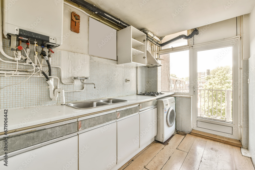 a kitchen area with white cabinets and an open door leading to the outside patio, which has been used for several years a kitchen area with white cabinets and an open door leading to the outside patio, which has been used for several years
