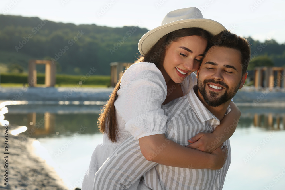 Romantic date. Beautiful couple spending time together near lake Romantic date. Beautiful couple spending time together near lake