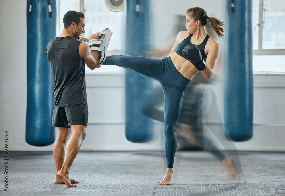 Naklejka premium Fighting female training with coach, learning kickboxing exercise at gym and doing cardio fitness workout for wellness with trainer at health club. Woman and man staying, active, healthy and sporty