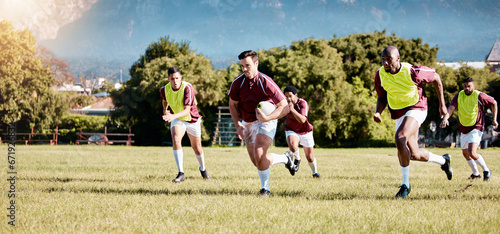 Fototapeta Naklejka Na Ścianę i Meble -  Game, sports and men playing rugby in a competition, match and running with a ball on a field. Fitness, exercise and players training for a team sport, cardio and collaboration in a park for practice
