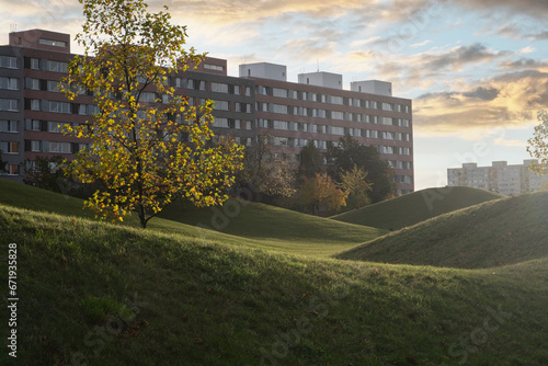 Photography city park in Prague, featuring lush green grassy hills, is illuminated by the warm of sun