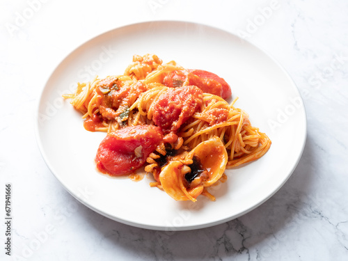 Tomato and cuttlefish pasta on a plate 