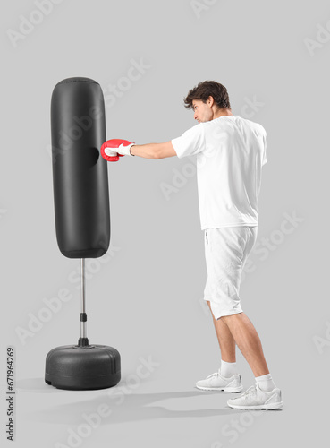 Young man in sportswear box...