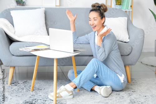 Mature woman with laptop vi...