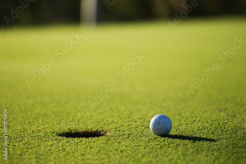 A golf ball and hole