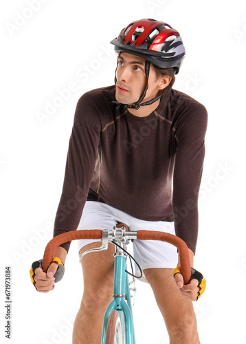 Young male cyclist riding b...