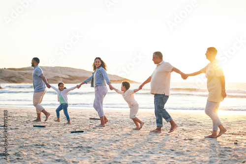Love, family walking and holding hands on beach in summer for vacation with sunshine or sea. Holiday, generations and kid or parents together at ocean for travel with trust for bonding with freedom.