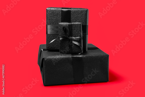 Gift boxes on red background. Black Friday