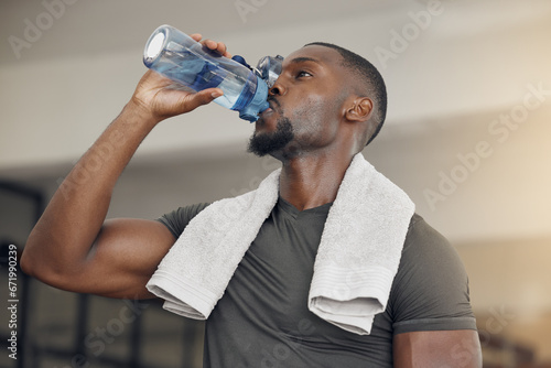 Fotografie Fitness, gym and black man drinking water after workout or training for hydration, health or wellness