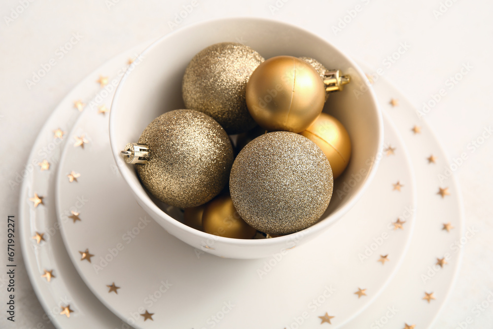 Beautiful table setting with Christmas balls on white background Beautiful table setting with Christmas balls on white background