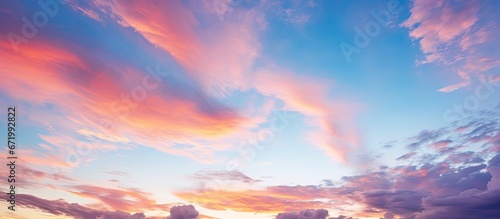 A sunset with clouds creates a vibrant and captivating sky