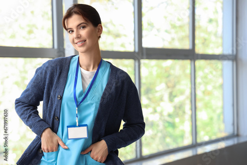Portrait of female medical intern in hall