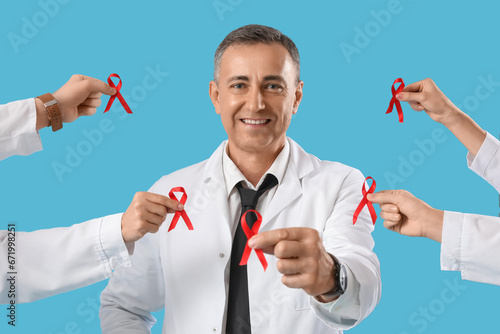 Mature male doctor and hand...
