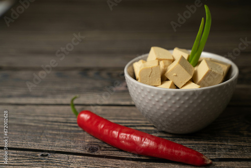 Tofu chopped on tha table photo