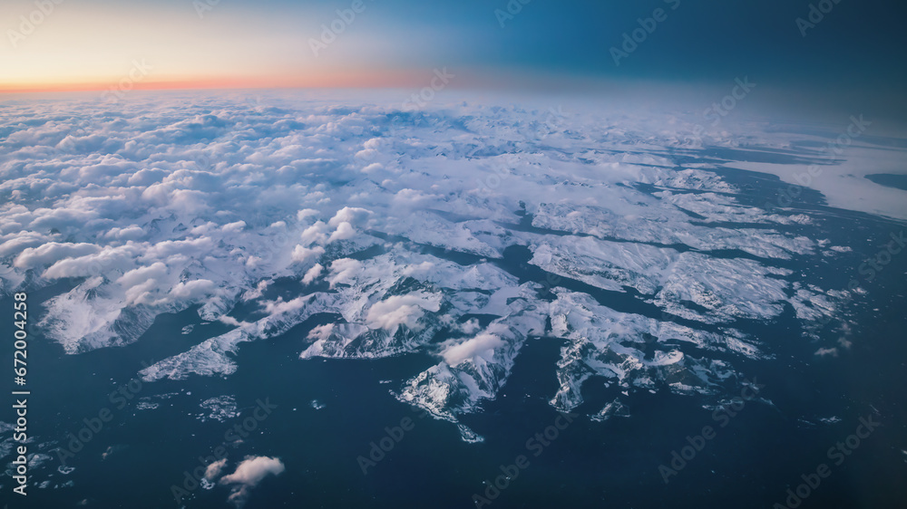 Spectacular panoramic view of the sunset over the rugged land of Southern Greenland Spectacular panoramic view of the sunset over the rugged land of Southern Greenland