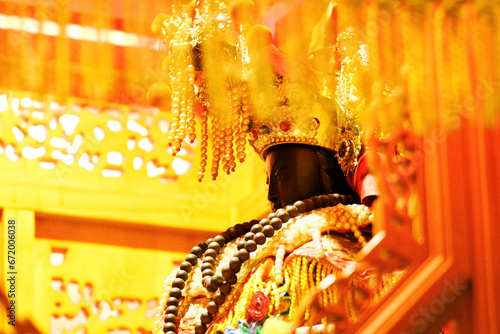Mazu, a Chinese sea goddess, sitting in a palanquin photo