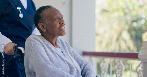 Woman, person with disability or wheelchair for help, balcony or support with smile, nurse or old. Retirement home, healthcare or elderly for medical, retired or worker for patient, caregiver or job