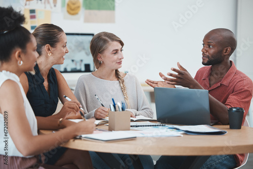 Diversity, team and creative meeting for startup company, business planning and group project workspace. Teamwork, conversation or brainstorming strategy communication in workplace or office at desk. photo