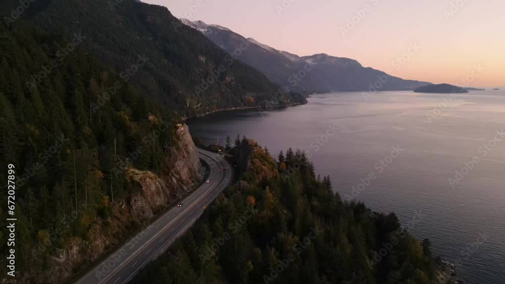Sea to Sky Highway on West Coast of Pacific Ocean. Aerial Mountain Landscape. Twilight sky. Howe Sound, BC, Canada. Sea to Sky Highway on West Coast of Pacific Ocean. Aerial Mountain Landscape. Twilight sky. Howe Sound, BC, Canada.