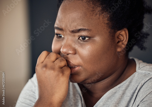 Nervous, scared and black woman with stress, anxiety or trauma from broken heart or divorce at home. Fear, biting nails or face of person worried by loss or disaster of death or frustrated by crisis