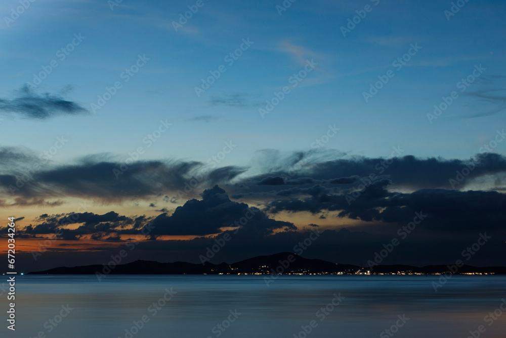 Sunset over the sea at Koh Larn with scenic clouds