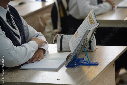Almaty, Kazakhstan - 09.06.2023 : Schoolchildren sit at their desks during school.