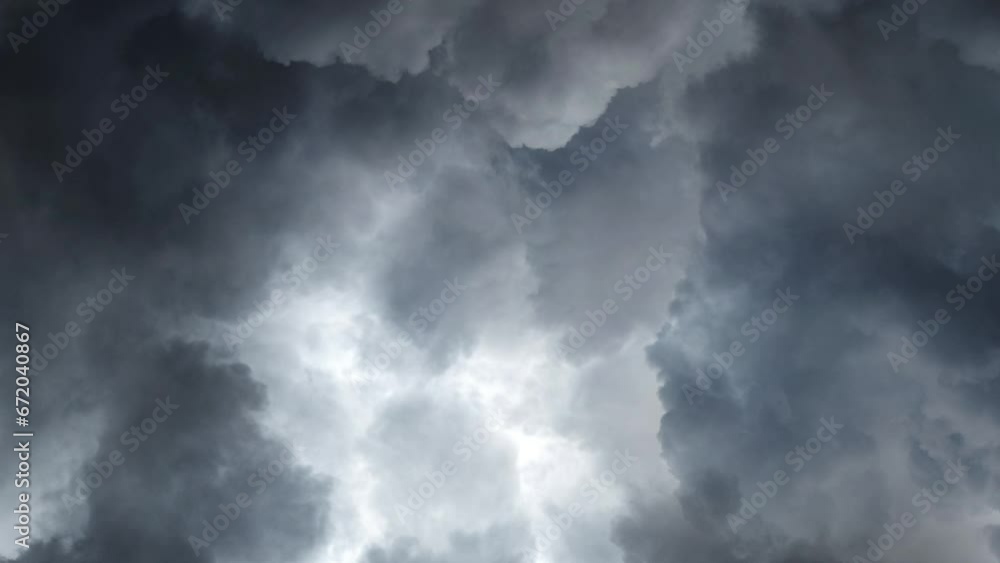 view of dark clouds accompanied by lightning strikes view of dark clouds accompanied by lightning strikes