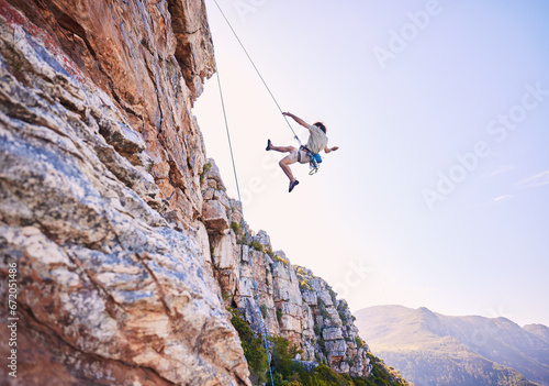 Rock climbing, jump and mountains with man in nature for sports, explore and adventure. Space, exercise and travel with person training on cliff for rope, challenge and performance mockup