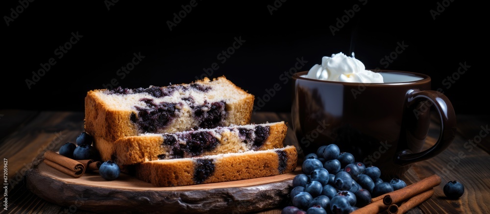 A wooden plank holds slices of pound cake accompanied by two small cups filled with blueberries and whipped cream A mug of coffee sits nearby against a backdrop of a rustic black wooden sur A wooden plank holds slices of pound cake accompanied by two small cups filled with blueberries and whipped cream A mug of coffee sits nearby against a backdrop of a rustic black wooden sur