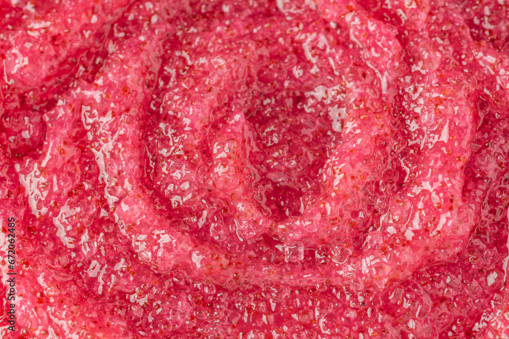Sugar or salt body scrub texture. Berry scrub - skin care product with fruit extract as cosmetic background with copy space. Macro photo