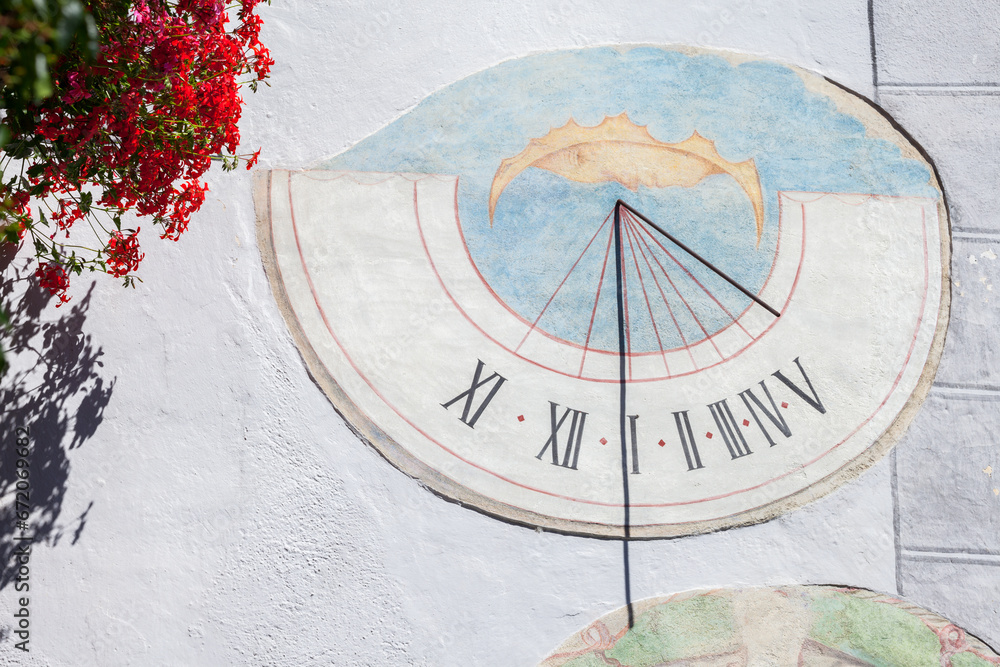 LAION, ITALY - SEPTEMBER 02, 2020: A recently restored sundial painted outside a private house in the town.