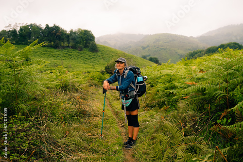 girl Hiker on countryside landscape in the Pyrenees, Pyrenees in France.