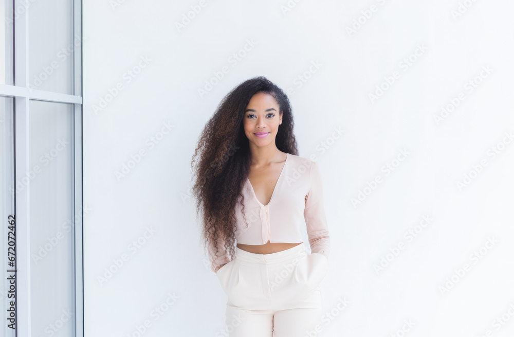 Portrait of a young beautiful African American woman with long curly hair Portrait of a young beautiful African American woman with long curly hair