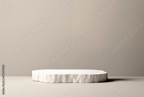White stone podium on a beige wall background. Ready for product display or montage. High quality photo