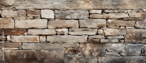 A smooth background with no interruptions featuring the weathered surface of an aged stone wall creates a vintage texture