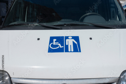 Wheelchair and elder symbol on front of the car