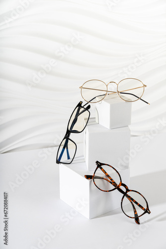 Obraz na plátně Trendy eyeglasses in plastic and metallic frame on a white background
